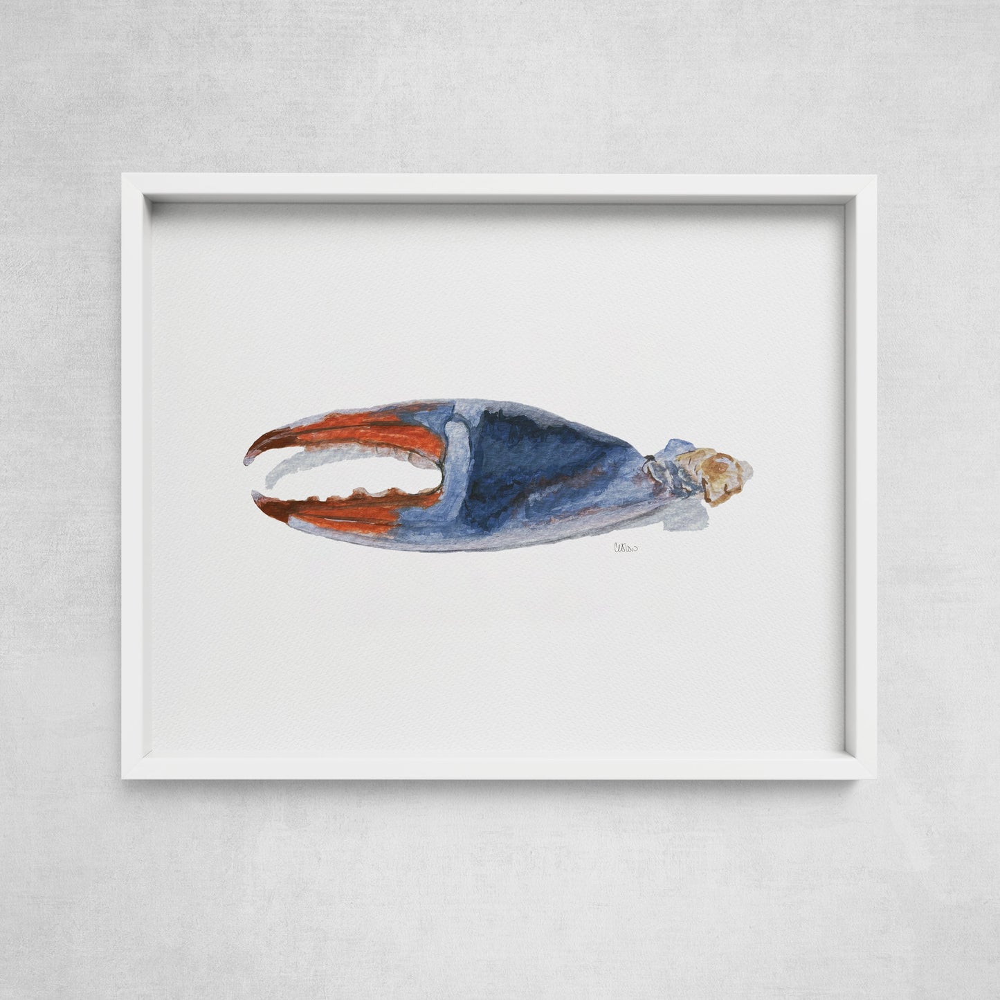 A framed watercolor print of a crab claw, with a blue, orange, and beige color palette, displayed against a white background.
