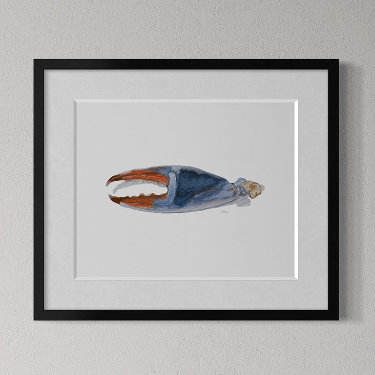 Framed artwork of a blue and orange abstract design on a gray wall