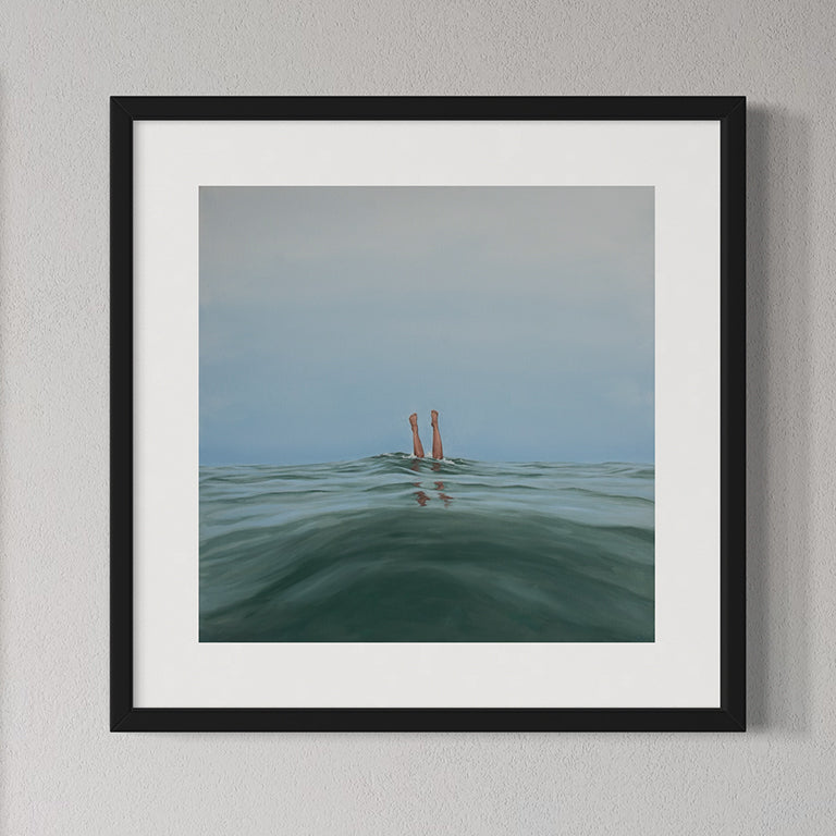 Framed artwork of a person's legs sticking out of water with a minimal background