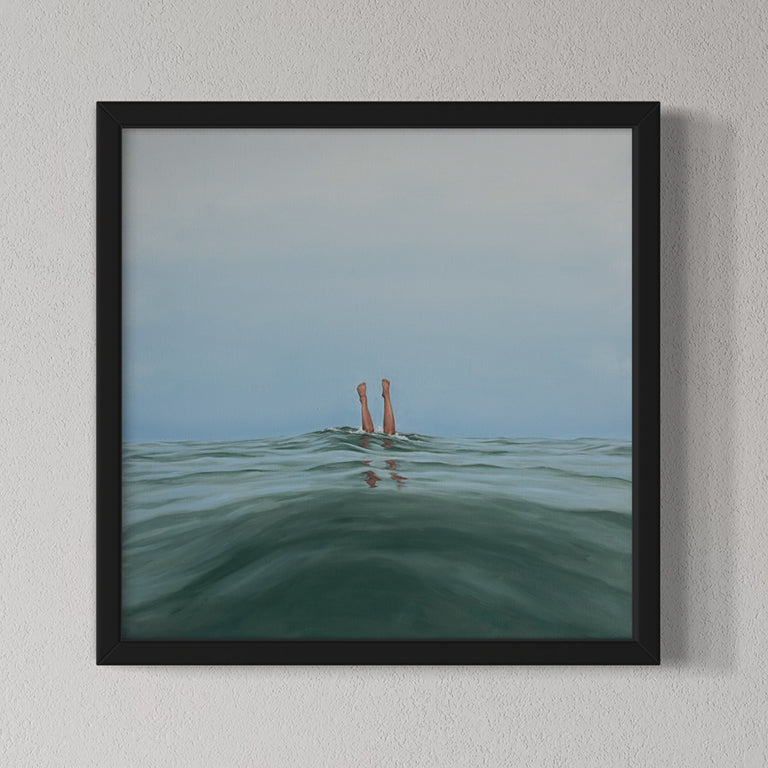 Framed artwork of feet in water against a light gray background