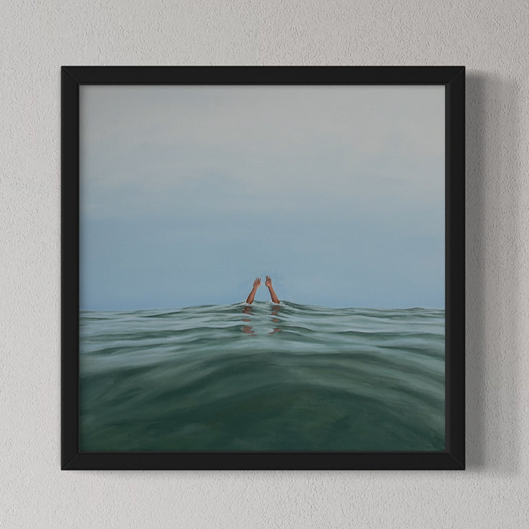 Framed artwork of a person partially submerged in water with a minimalistic background