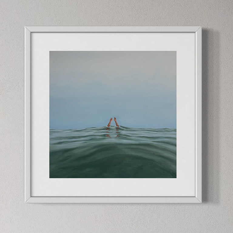 Framed artwork of a person in the water with a minimalistic background