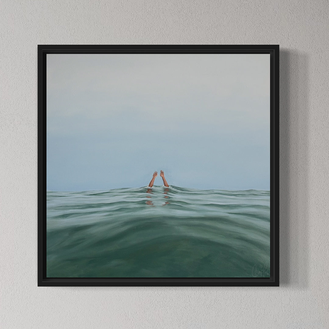 Framed artwork of a person's head emerging from water with a minimalistic background