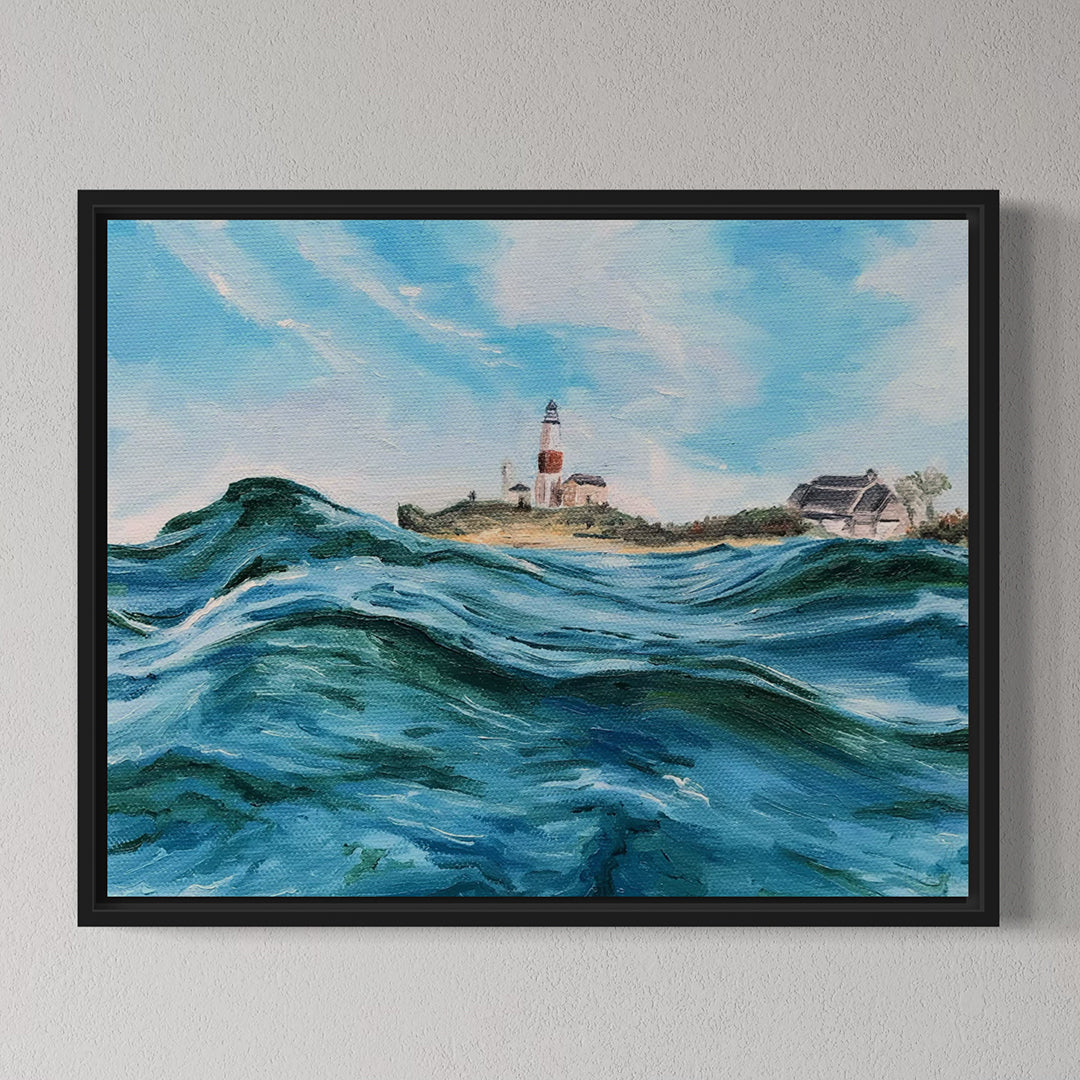 Framed painting of a lighthouse on an island with choppy waters and a blue sky.