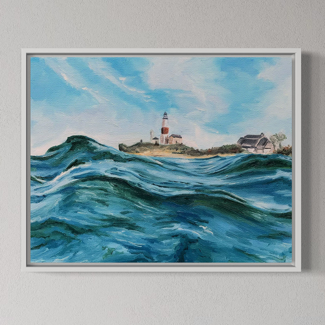 Framed painting of a lighthouse with crashing waves on a gray wall