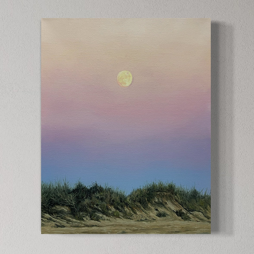 Canvas print of a landscape with a moon over grassy dunes on a light gray background