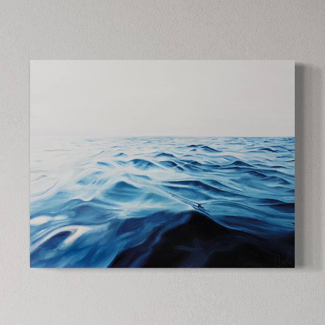 Canvas print of wavy blue water on a gray wall