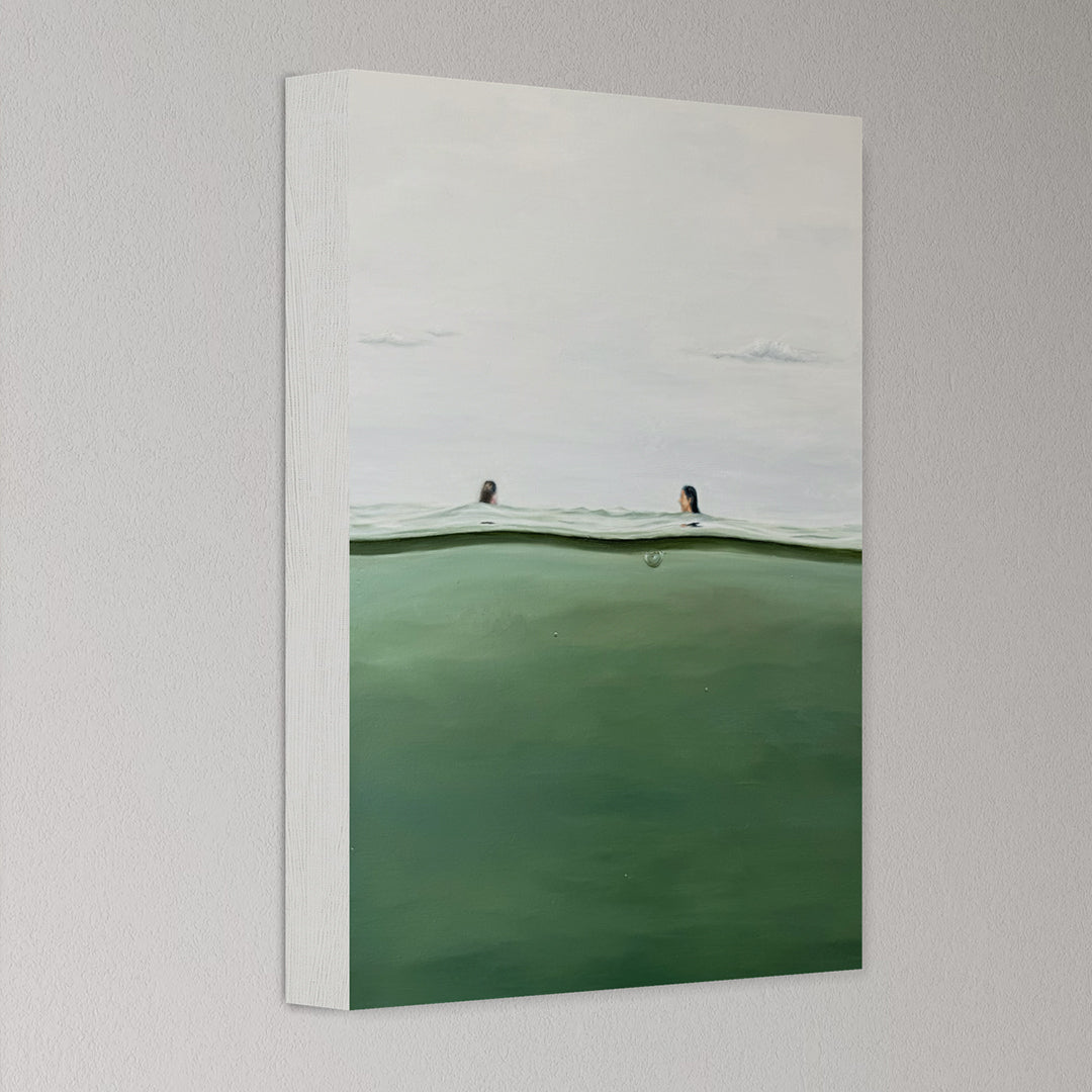 Canvas print of a landscape with green field and white sky on a gray wall