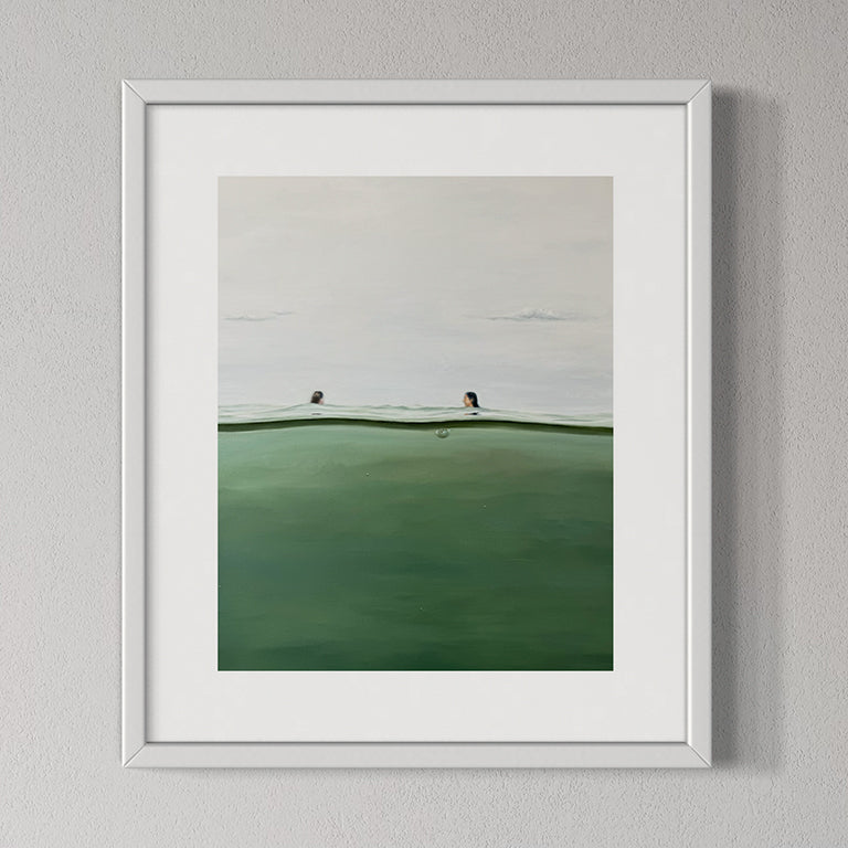 Framed artwork of a landscape with a white frame on a gray wall