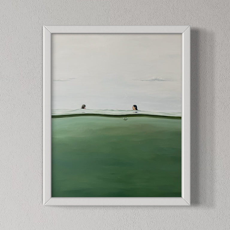 Framed artwork of a minimalistic landscape with a white frame on a gray wall.