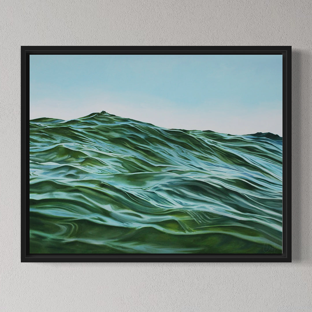 Framed artwork of wavy green landscape on a gray wall
