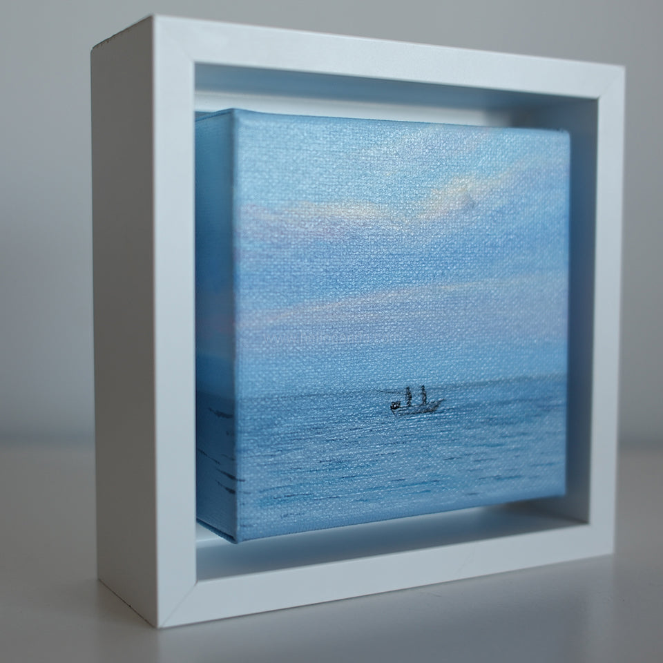 Side angle of Mini #42 framed 4x4 coastal artwork — textured oil painting of fishermen on serene ocean water.