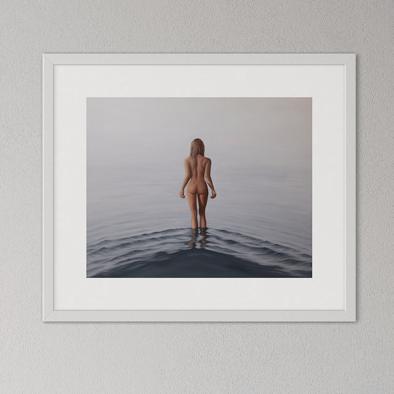 Framed artwork of a nude figure standing in water on a gray wall.