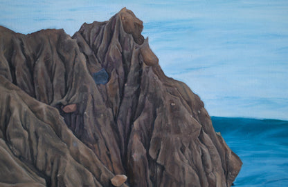 Close-up of a textured brown rock formation against a blue background