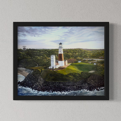 Framed painting of a lighthouse on a rocky outcrop with a coastal landscape.