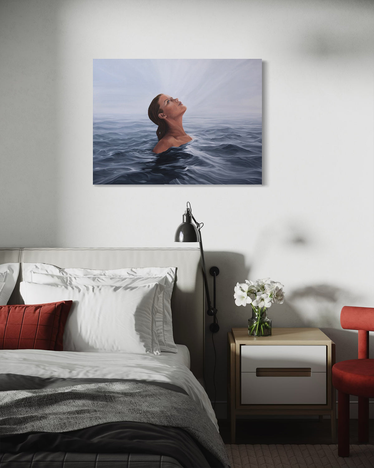 A square wall art print depicting a woman's head and shoulders above the water in a calm ocean, styled in a modern bedroom setting above a bed.