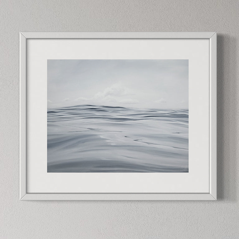 Framed artwork of wavy lines on a gray background