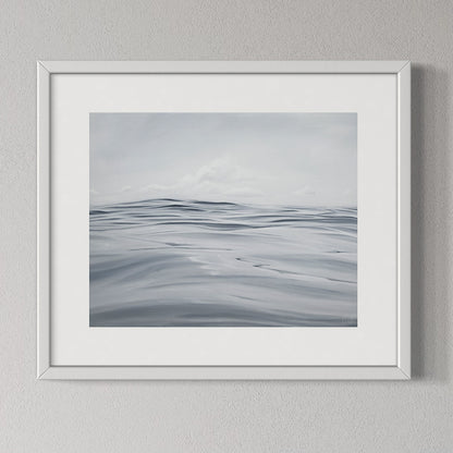 Framed artwork of wavy lines on a gray background