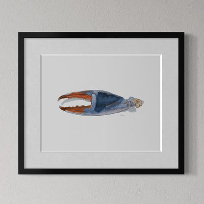 Framed artwork of a blue and orange abstract design on a gray wall