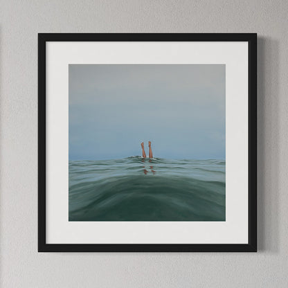 Framed artwork of a person's legs sticking out of water with a minimal background