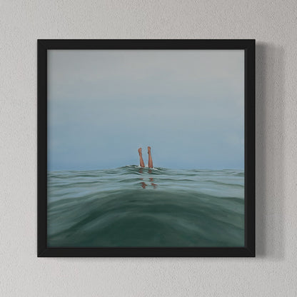 Framed artwork of feet in water against a light gray background