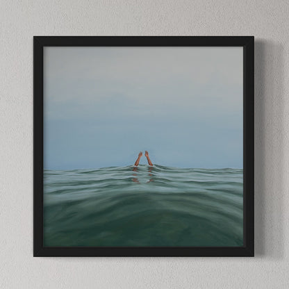 Framed artwork of a person partially submerged in water with a minimalistic background