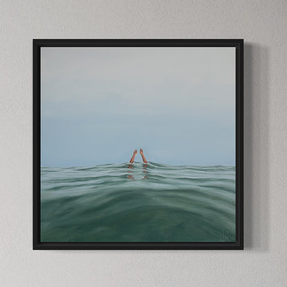 Framed artwork of a person's head emerging from water with a minimalistic background