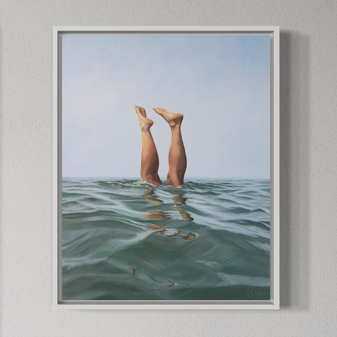Framed artwork of legs diving into water with a light gray background