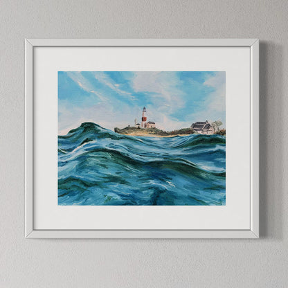 Framed painting of a lighthouse by the sea on a gray wall