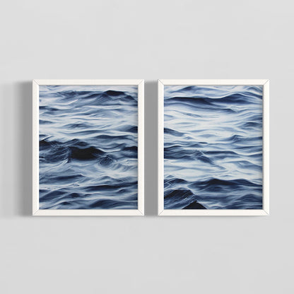 Two framed artworks of wavy blue patterns on a gray background