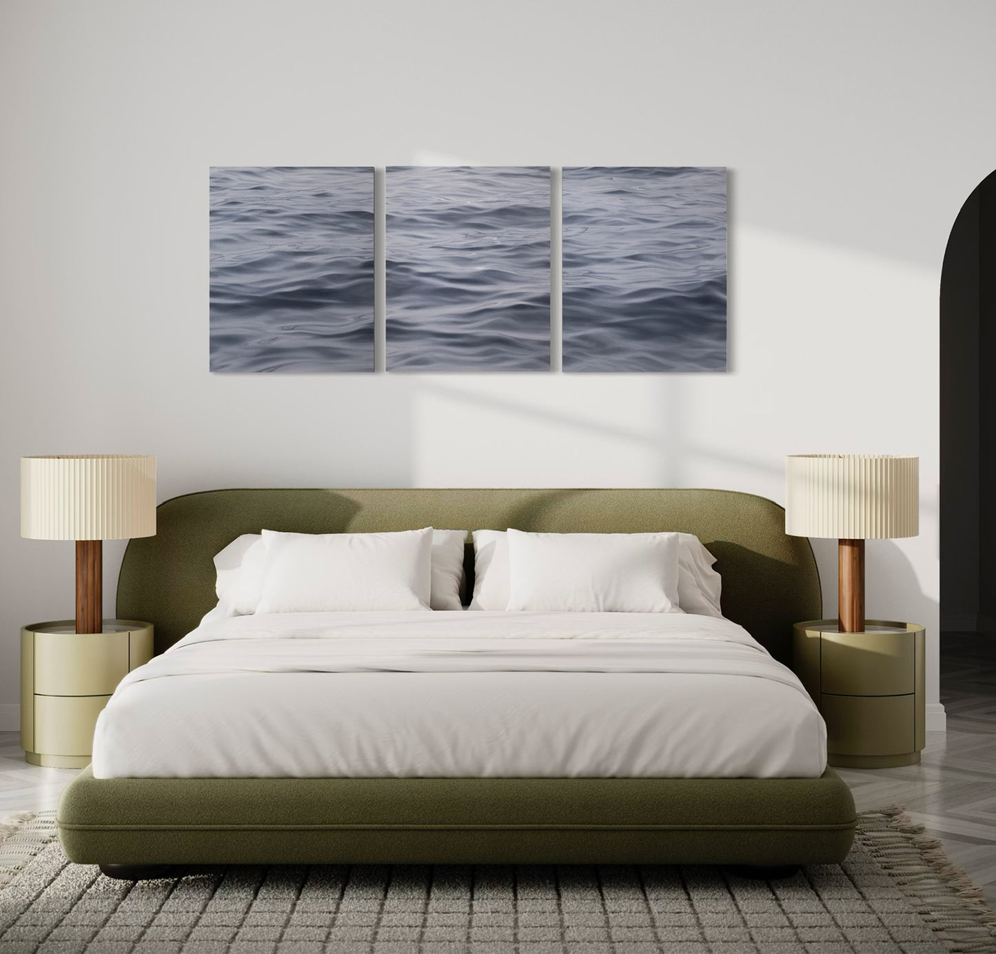 Large original triptych ocean painting above bed in modern bedroom with soft neutral decor.