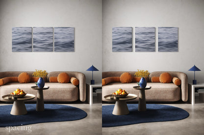Example of spacing between panels for large triptych seascape wall art in modern living room.