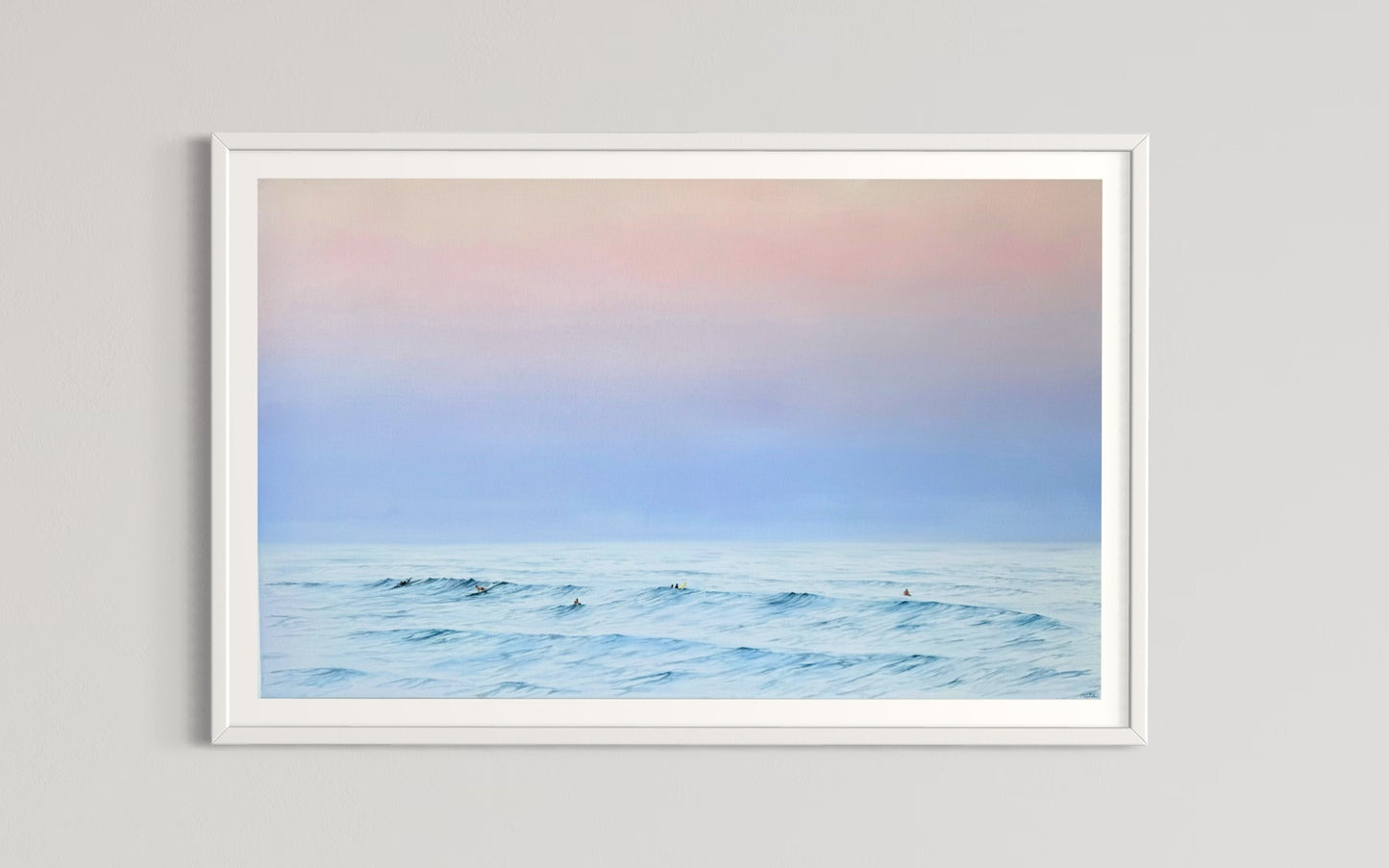 A framed limited edition fine art print titled 'Twilight Whispers' depicting a serene coastal scene with surfers and a pastel-colored sky.