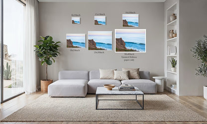 All We Have is Here coastal cliff art print size comparison chart from 8x10 to 30x40 inch limited edition, shown in a living room