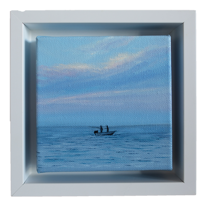 Mini #42 original coastal oil painting framed in white — small artwork of fishermen on calm blue water under pastel sky by artist Candace Ceslow.
