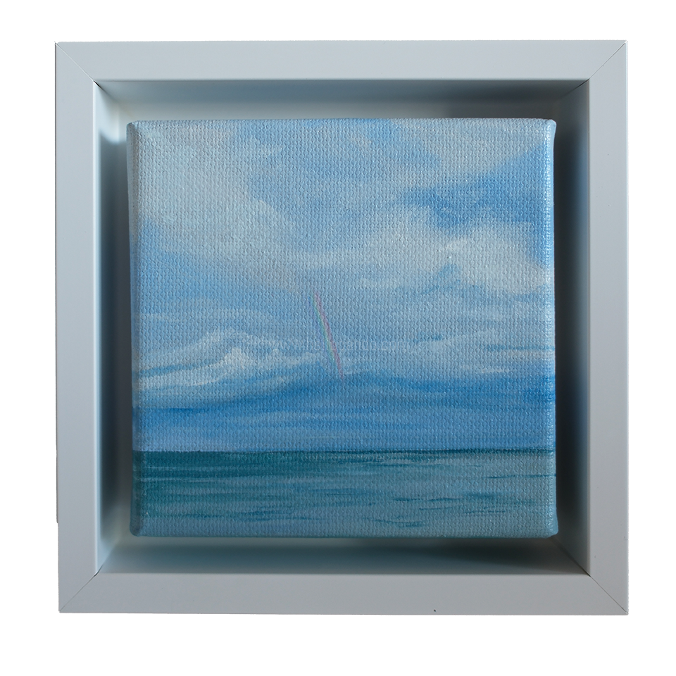 Mini oil painting of a faint rainbow over the ocean beneath soft clouds.