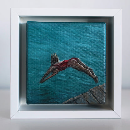 Mini #41 original swimmer oil painting framed in white — small coastal artwork of woman diving into turquoise water.