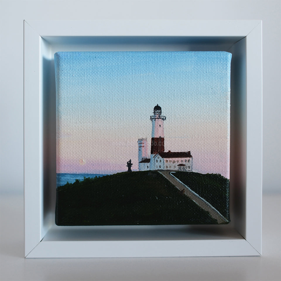 Original 4x4 Montauk Lighthouse painting at sunrise by coastal artist Candace Ceslow — soft pastel sky seascape in white frame.