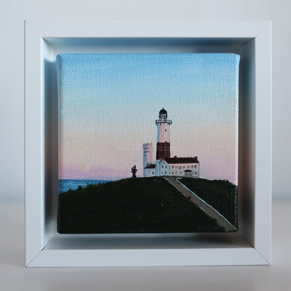 Original 4x4 Montauk Lighthouse painting at sunrise by coastal artist Candace Ceslow — soft pastel sky seascape in white frame.