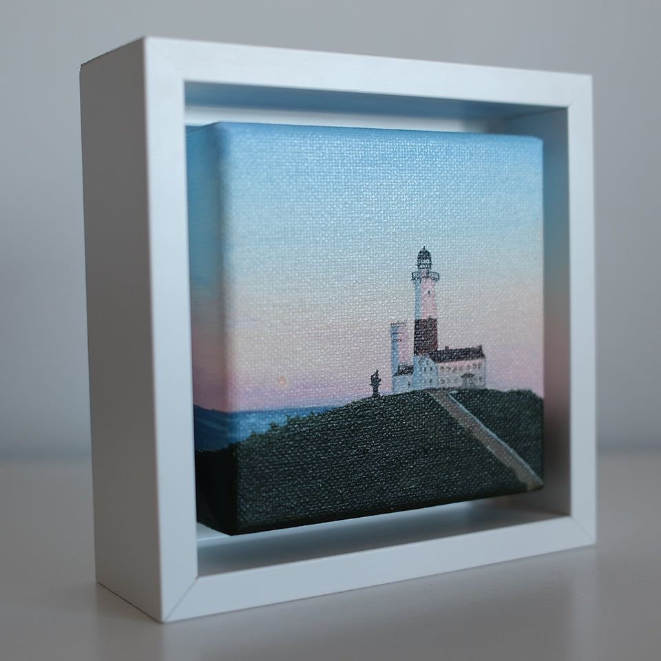 Side view of Mini #43 Montauk Lighthouse sunrise painting — thick 4x4 oil canvas in white shadow-box frame by Candace Ceslow.