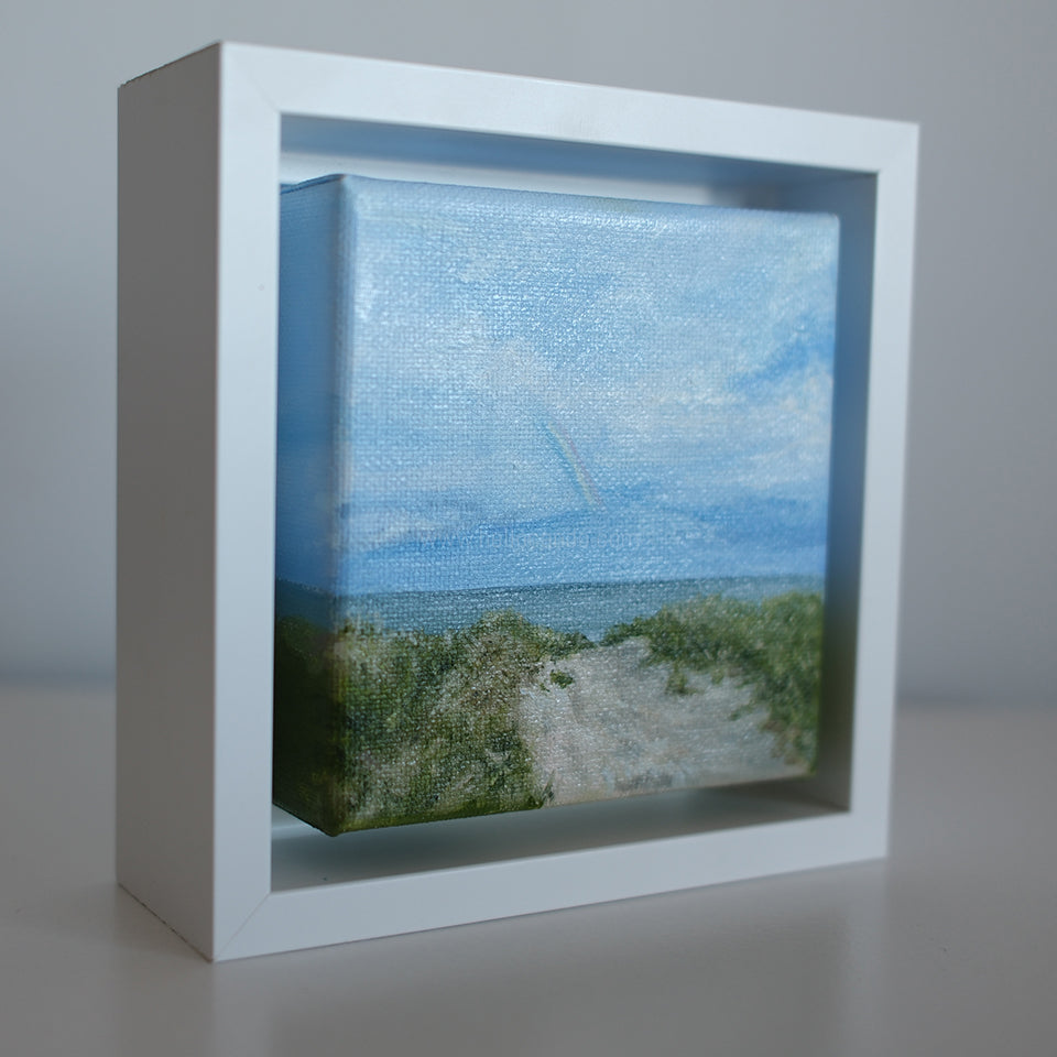 Side angle of Mini #51 framed mini painting showing depth of canvas and white shadowbox frame.