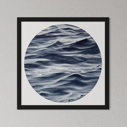 Framed artwork of wavy water pattern on a gray wall
