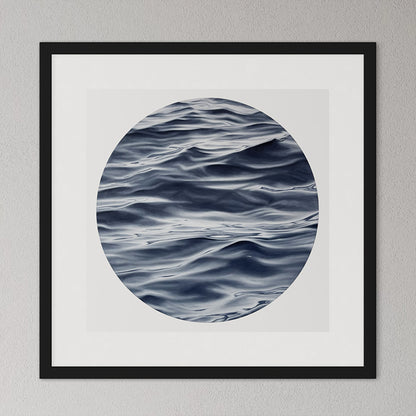 Framed artwork of wavy water pattern on a gray wall