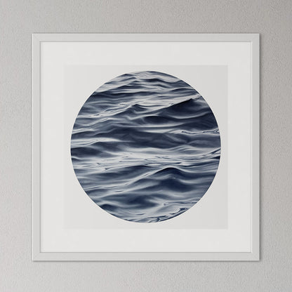 Framed artwork of wavy water pattern on a gray wall