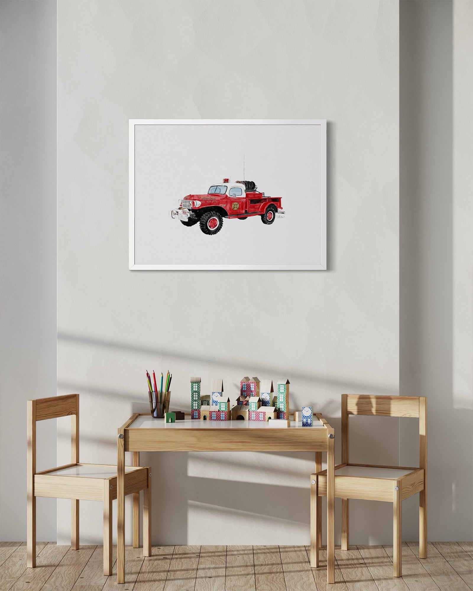 Vintage Montauk fire truck watercolor-style print in white frame above children's play table by Candace Ceslow