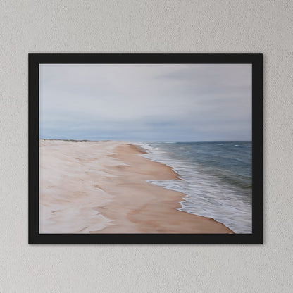 Framed artwork of a beach scene with ocean and sky.