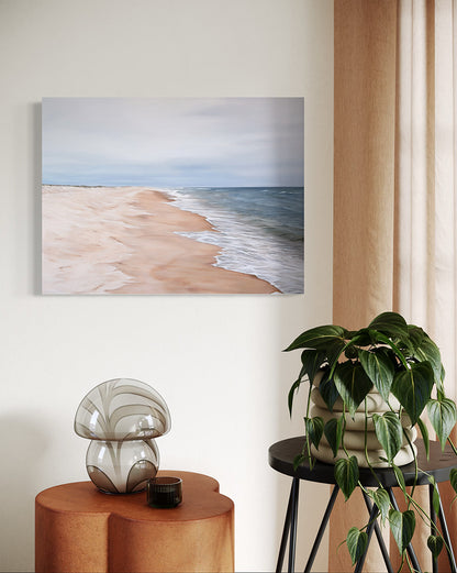 Room interior with a beach painting, decorative mushroom sculpture, and potted plant.